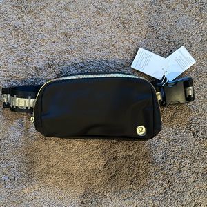 Lululemon Everywhere Belt Bag Black and Gold. Never used, smoke free house.